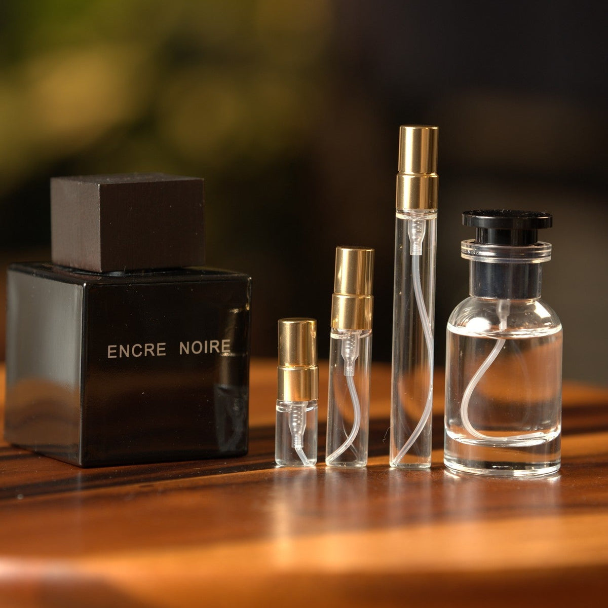 lalique-encre-noire decant bottle and vials