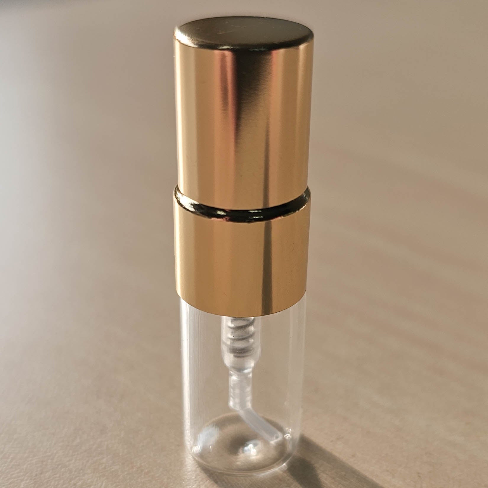 Atelier Elemental 2 ml decant vial with gold screw-top fine mist atomizer, the size included in every set