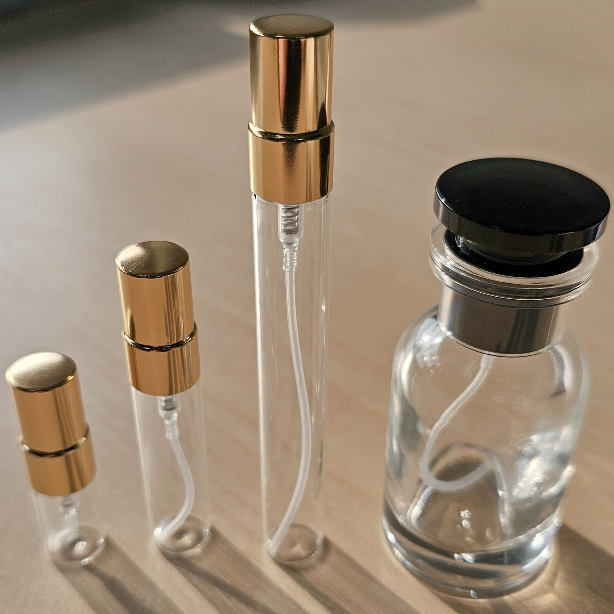 Decant bottle sizes lined up: 2ml, 5ml, 10ml and the 30ml