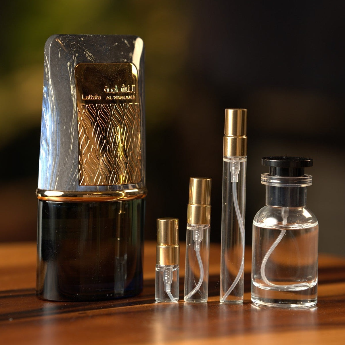 lattafa-al-nashama-caprice decant bottle and vials
