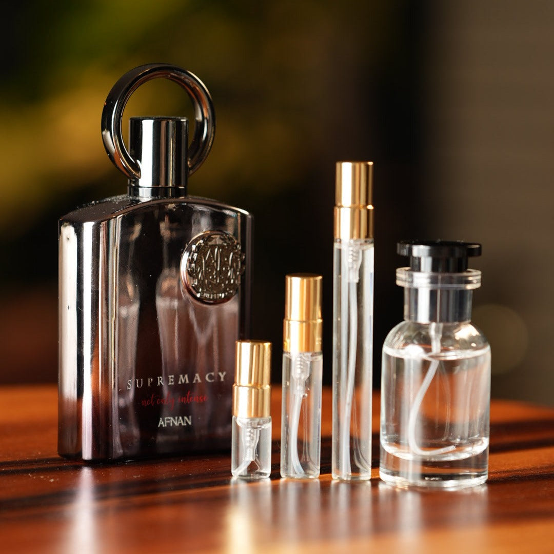 afnan-supremacy-not-only-intense decant bottle and vials