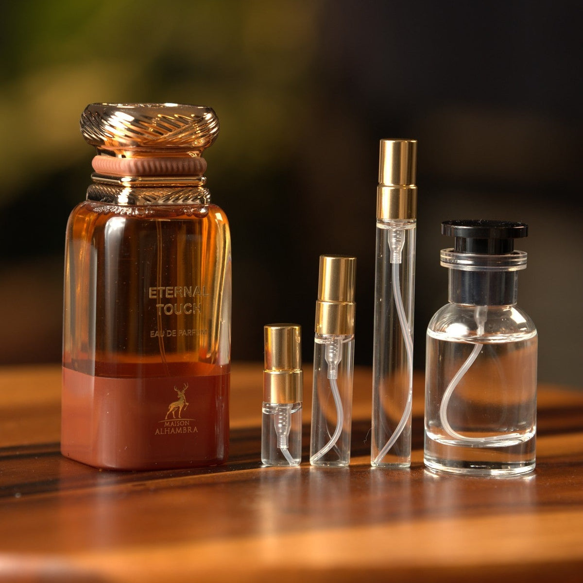 lattafa-maison-alhambra-eternal-touch decant bottle and vials