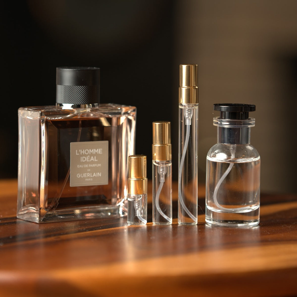 Guerlain L'Homme Ideal Eau de Parfum bottle with Atelier Elemental decant vials