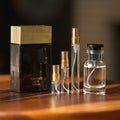 Tom Ford Noir Extreme bottle with Atelier Elemental decant vials