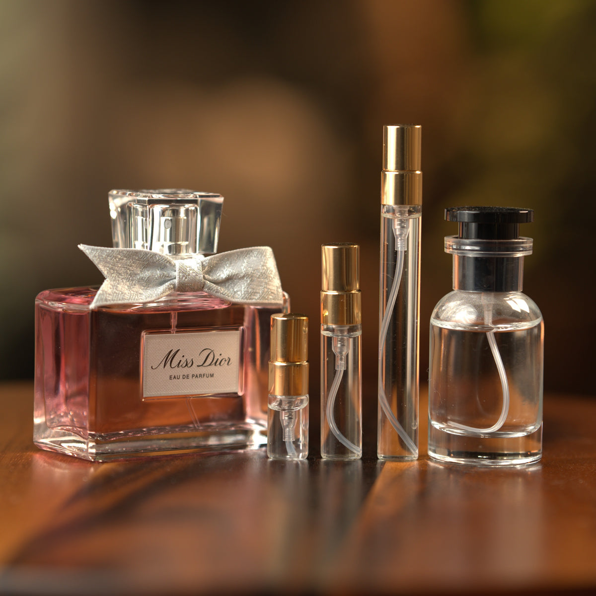 Dior Miss Dior EDP decant: full bottle beside 2 ml, 5 ml and 10 ml Atelier Elemental vials