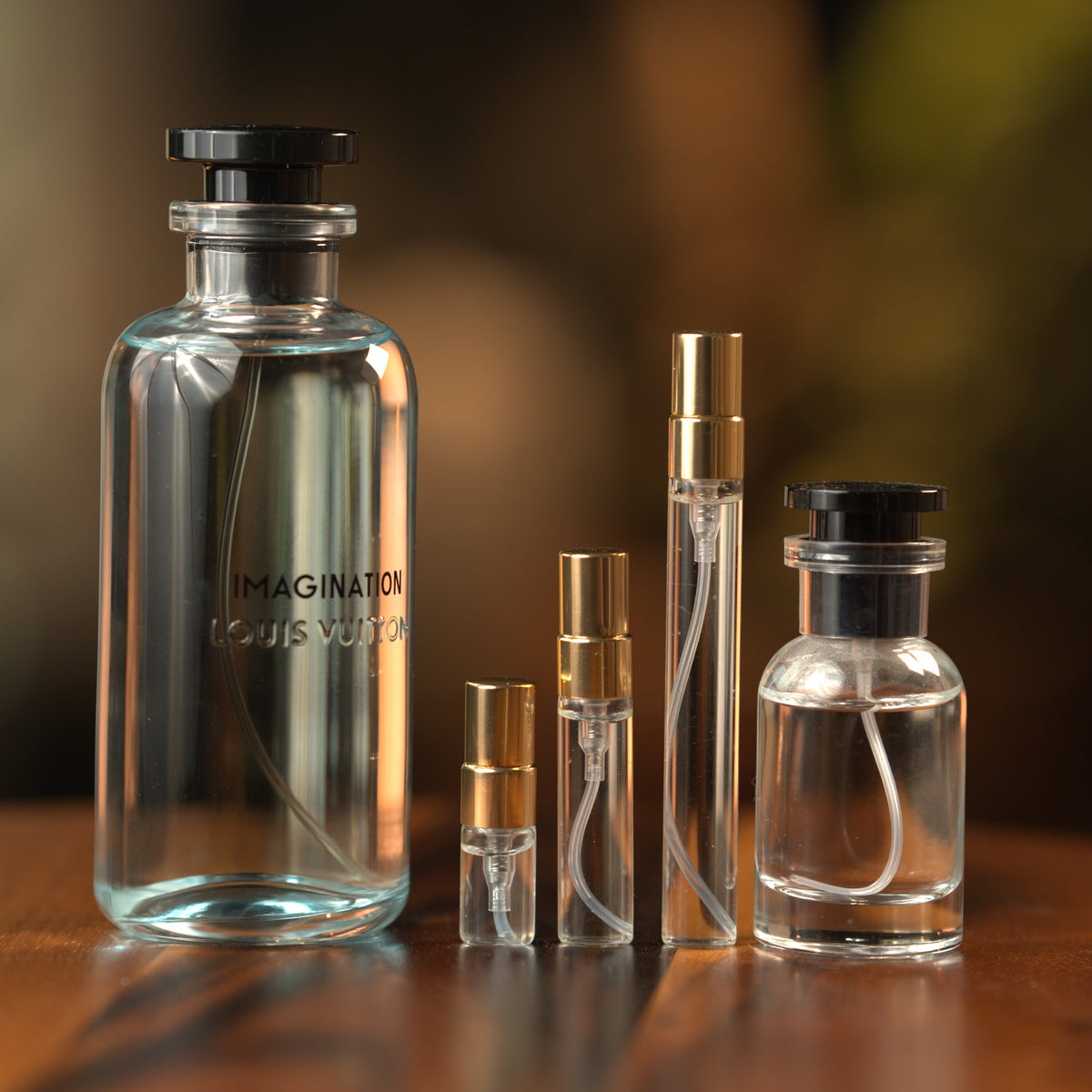 Louis Vuitton Imagination decant: full bottle beside 2 ml, 5 ml and 10 ml Atelier Elemental vials
