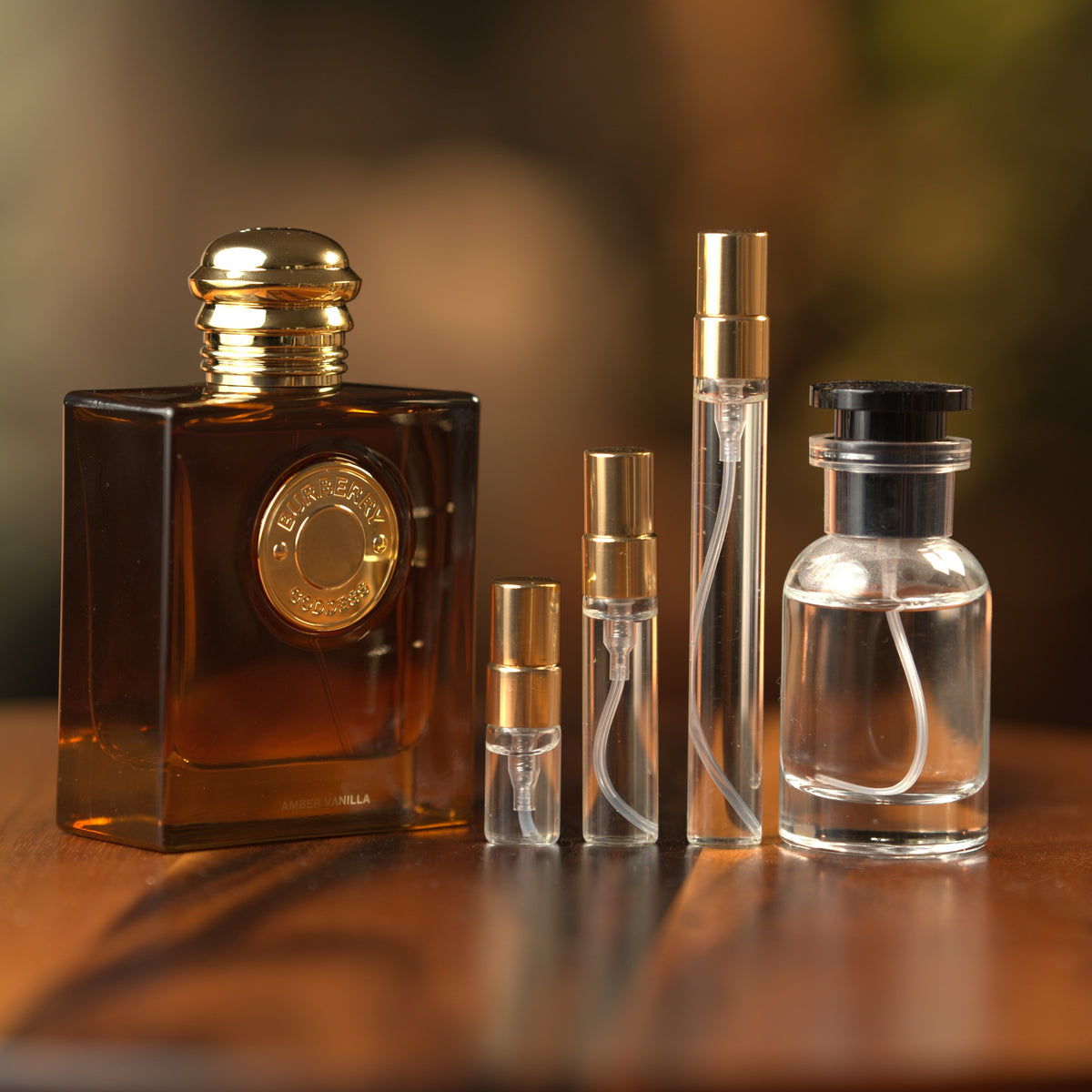 Burberry Goddess Amber Vanilla Intense EDP decant: full bottle beside 2 ml, 5 ml and 10 ml Atelier Elemental vials