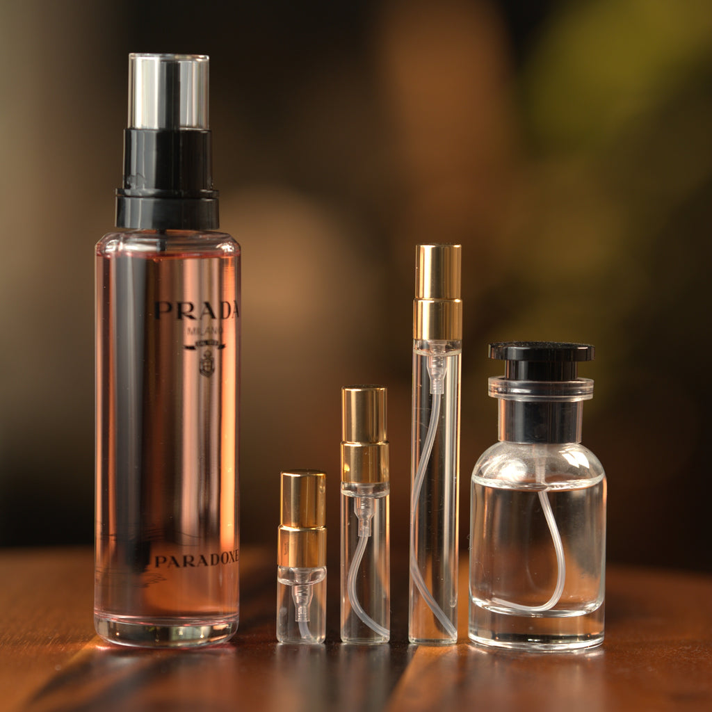 Prada Paradoxe EDP decant: full bottle beside 2 ml, 5 ml and 10 ml Atelier Elemental vials