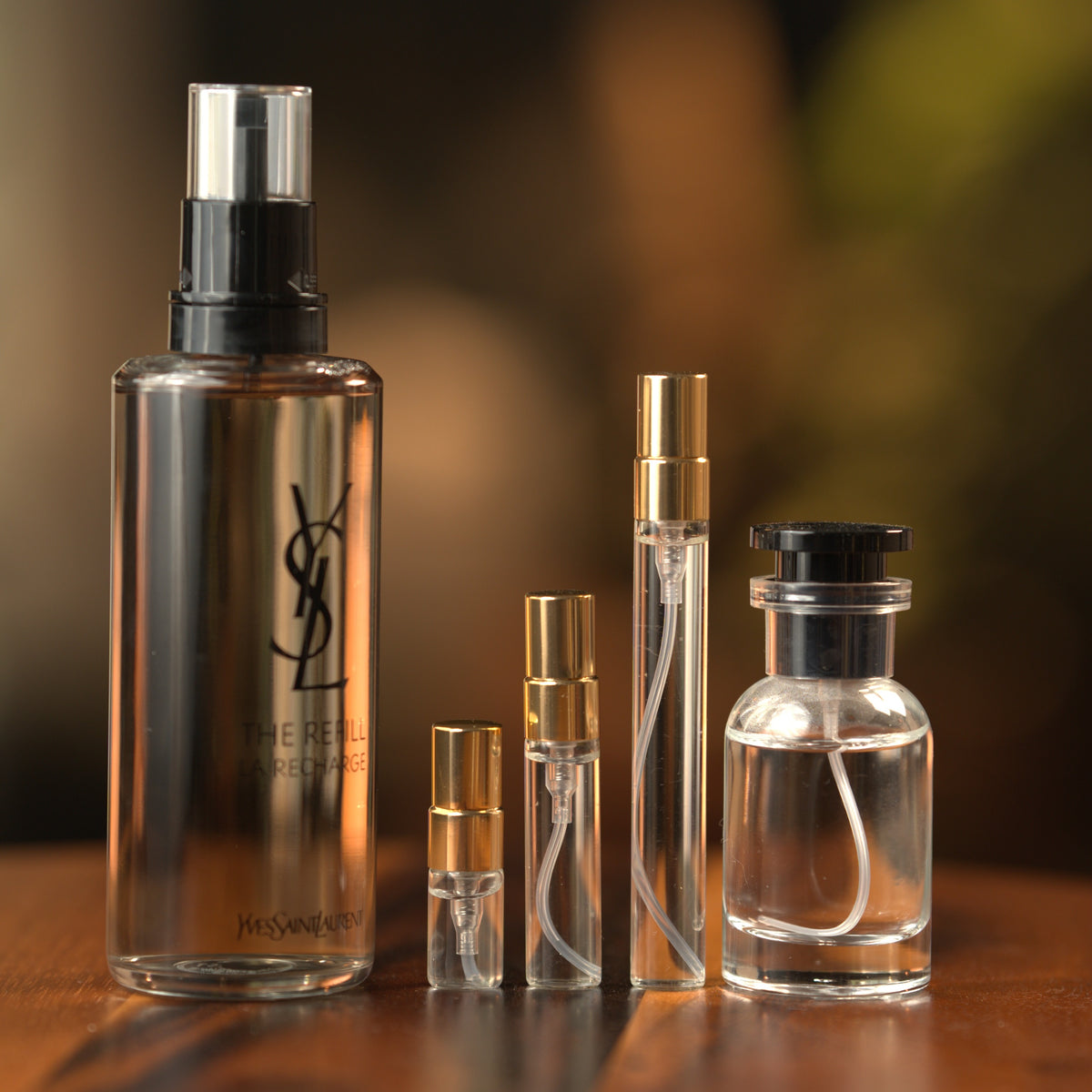 Yves Saint Laurent MYSLF EDP decant: full bottle beside 2 ml, 5 ml and 10 ml Atelier Elemental vials