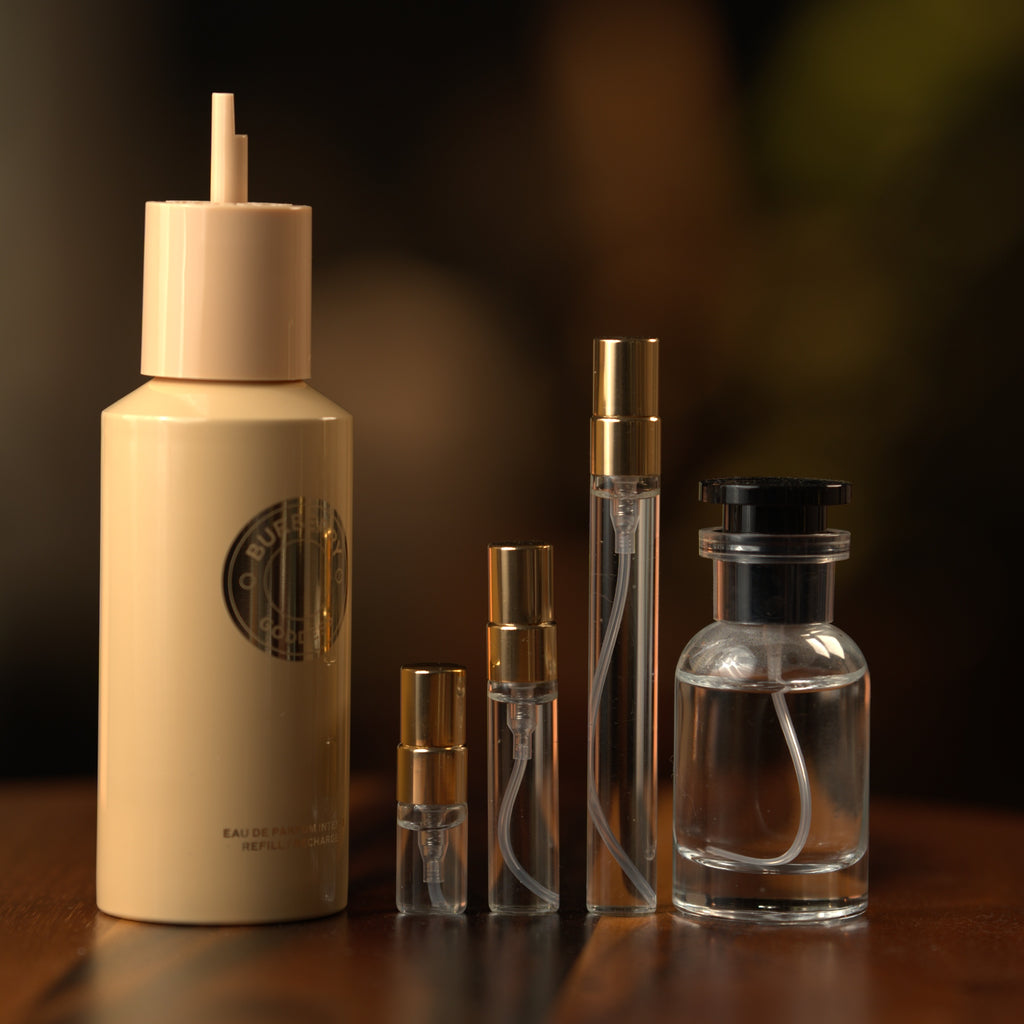 Burberry Goddess Intense EDP decant: full bottle beside 2 ml, 5 ml and 10 ml Atelier Elemental vials