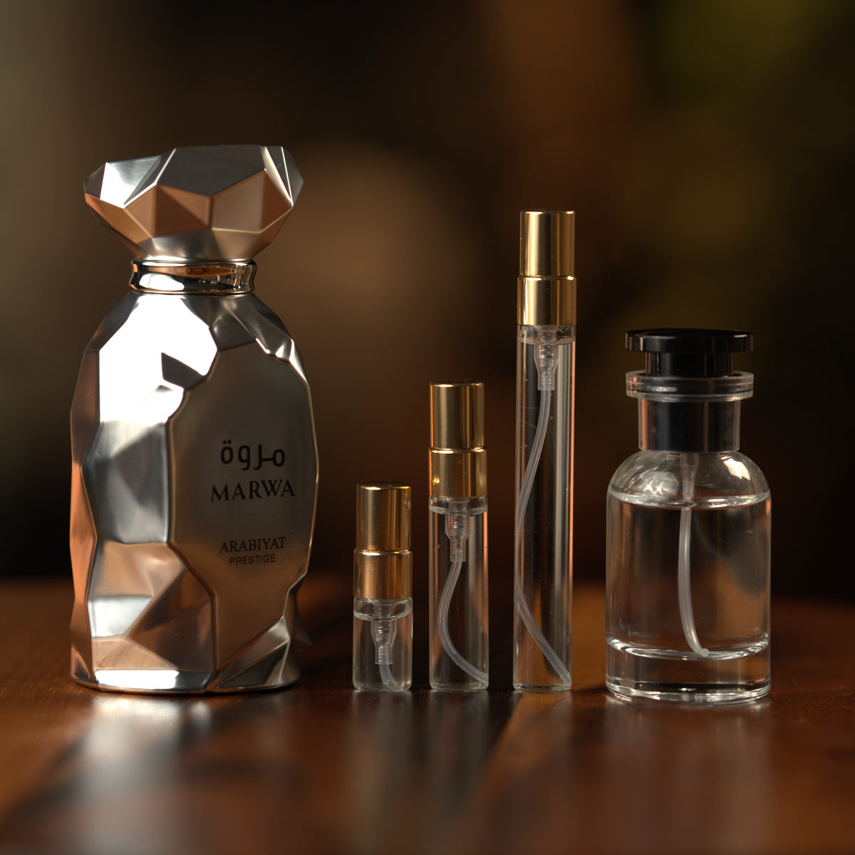 Arabiyat Prestige Marwa decant: full bottle beside 2 ml, 5 ml and 10 ml Atelier Elemental vials