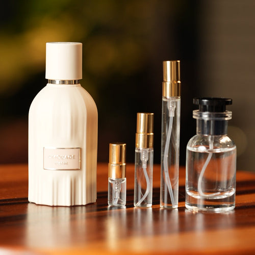 amouage-lustre decant bottle and vials