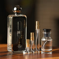Afnan 9pm bottle with Atelier Elemental decant vials