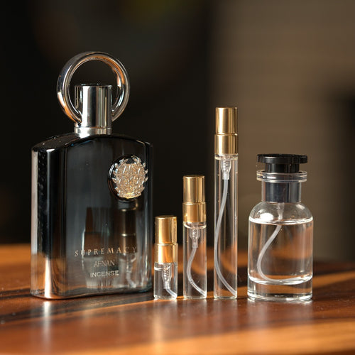Afnan Supremacy Incense bottle with Atelier Elemental decant vials