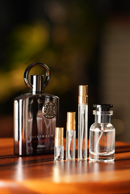 AFNAN SUPREMACY NOT ONLY INTENSE EXTRAIT bottle and decant vials