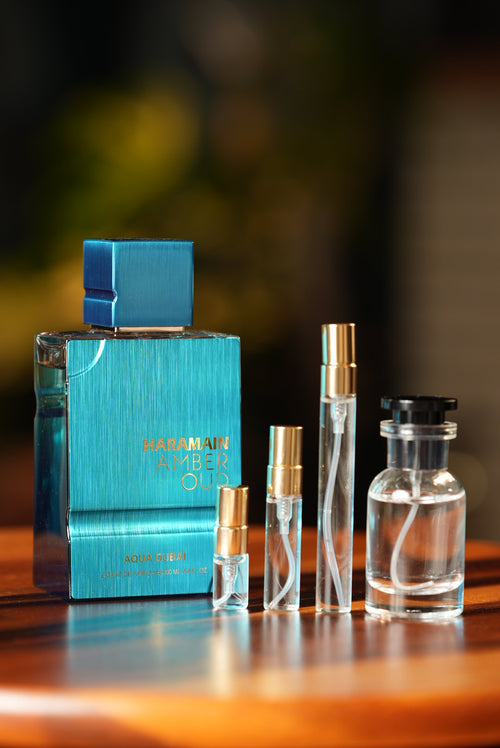 AL HARAMAIN AMBER OUD AQUA DUBAI EXTRAIT bottle and decant vials
