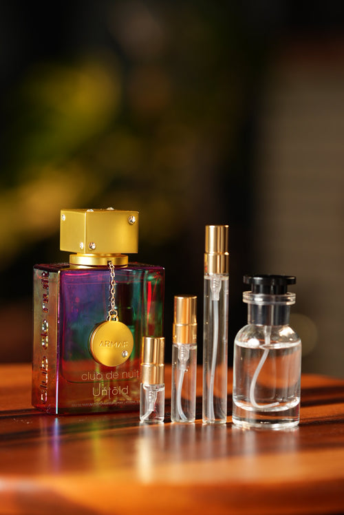 ARMAF CLUB DE NUIT UNTOLD bottle and decant vials