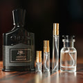 CREED ABSOLU AVENTUS perfume bottle beside decant vials