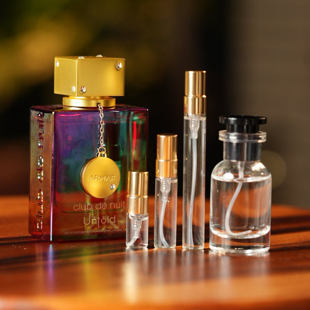 armaf-club-de-nuit-untold decant bottle and vials