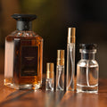 Guerlain Angélique Noire eau de parfum beside Atelier Elemental decant vials in 2 ml, 5 ml, 10 ml and 30 ml sizes