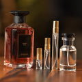 Guerlain Cherry Oud eau de parfum beside Atelier Elemental decant vials in 2 ml, 5 ml, 10 ml and 30 ml sizes