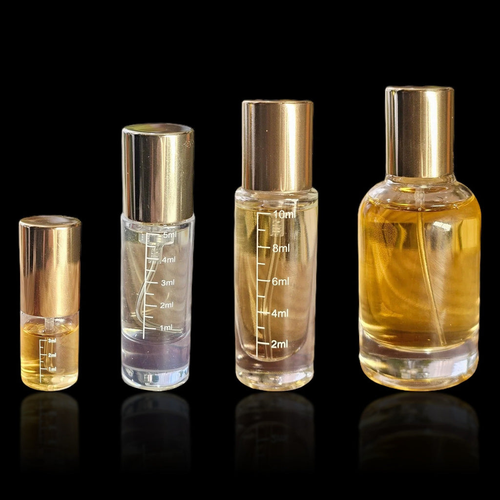 Luxury crimp vials in 3, 5, 10 and 30 mL sizes with gold caps, on a black background