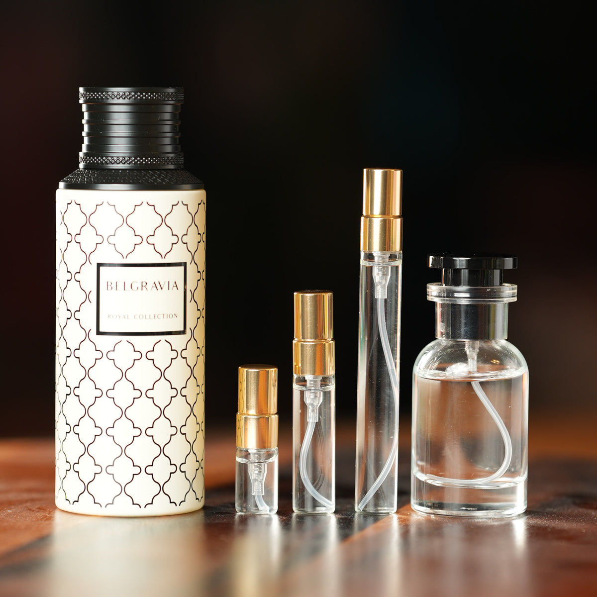 MAISON ASRAR BELGRAVIA perfume bottle beside decant vials