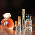 MAISON ASRAR VANILLA VOYAGE perfume bottle beside decant vials