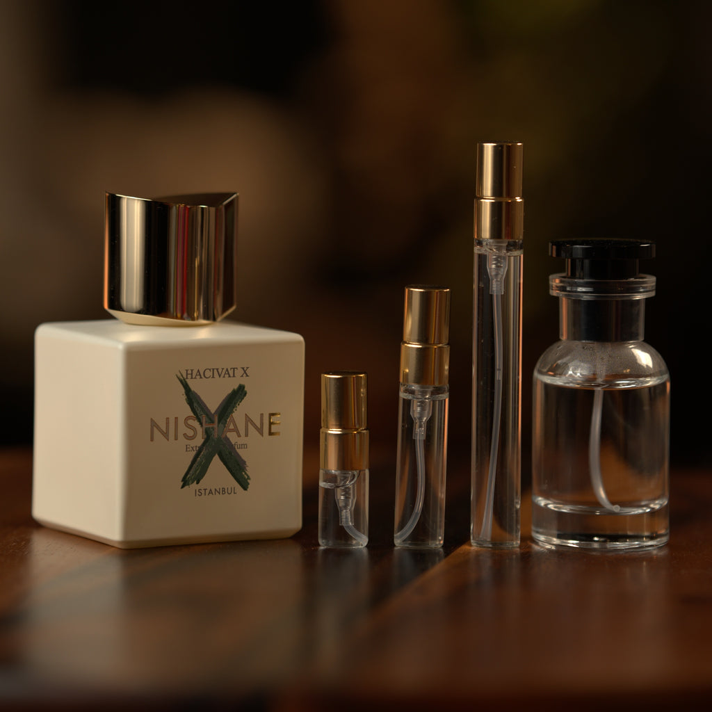 Nishane Hacivat X extrait de parfum beside Atelier Elemental decant vials in 2 ml, 5 ml, 10 ml and 30 ml sizes
