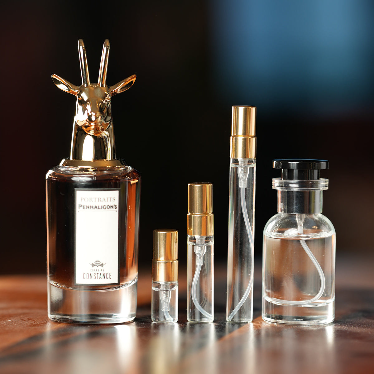 PENHALIGON'S CHANGING CONSTANCE perfume bottle beside decant vials