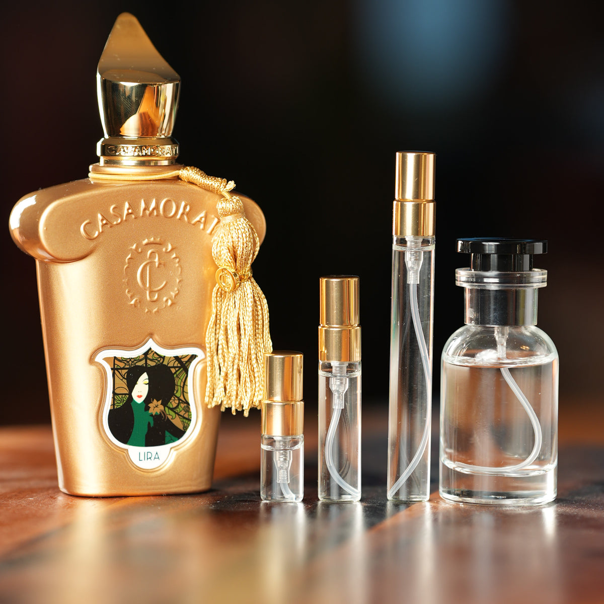XERJOFF LIRA perfume bottle beside decant vials