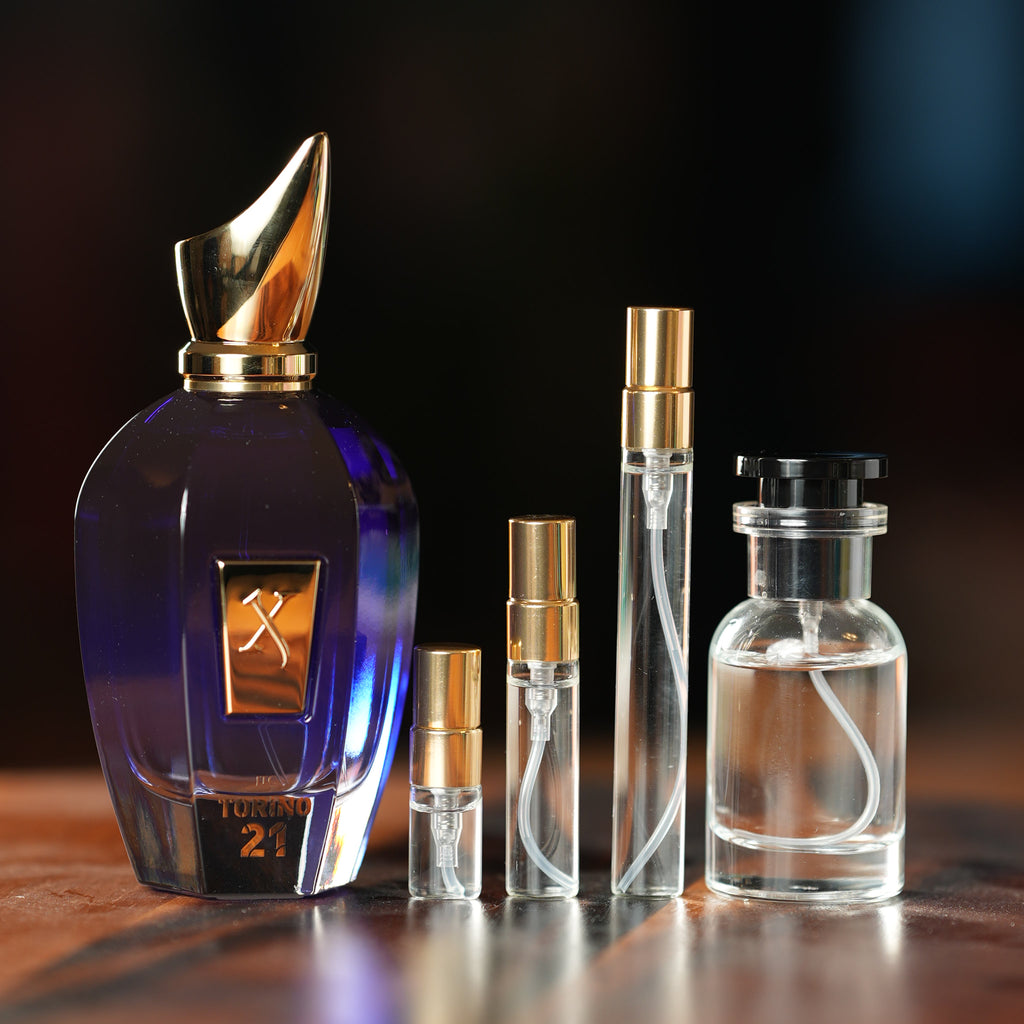 XERJOFF TORINO21 perfume bottle beside decant vials